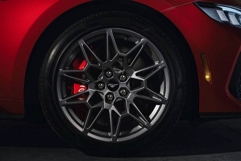 2024 Ford Mustang® model with a close-up of a wheel and brake caliper | E. J. Barrette and Sons in Swanton VT