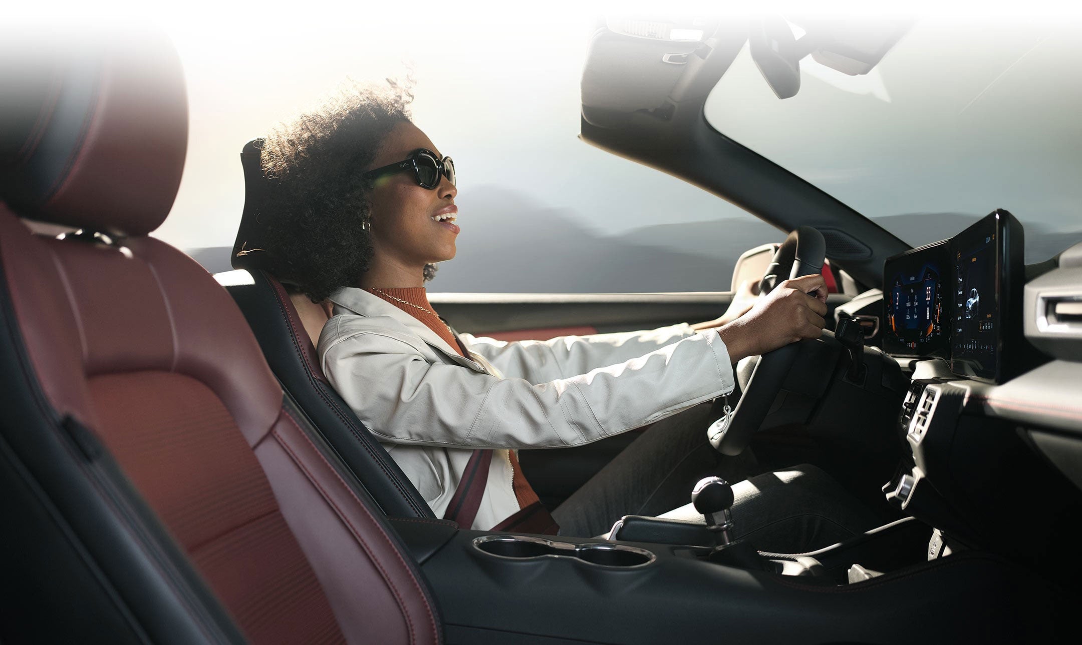 Person sitting in the driver’s seat of a 2024 Ford Mustang® convertible | E. J. Barrette and Sons in Swanton VT